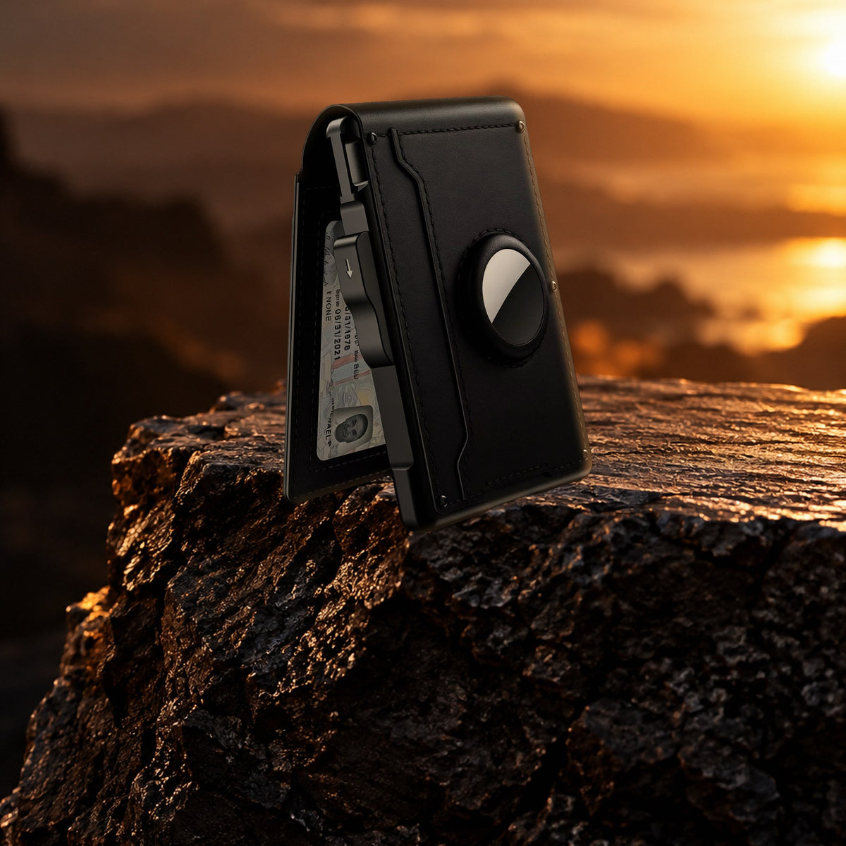 WALV Pop-Up Wallet in Midnight Black on a dark rock, back with the AirTag slot